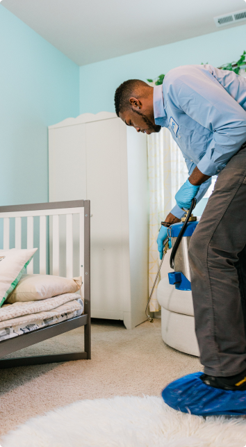 Pest control technician in the home