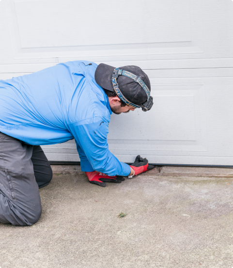 Technician treating a garage