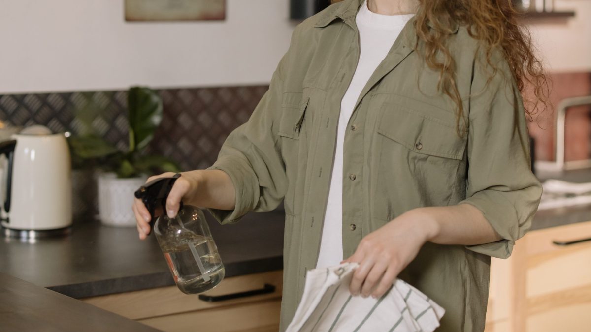 Woman spraying table