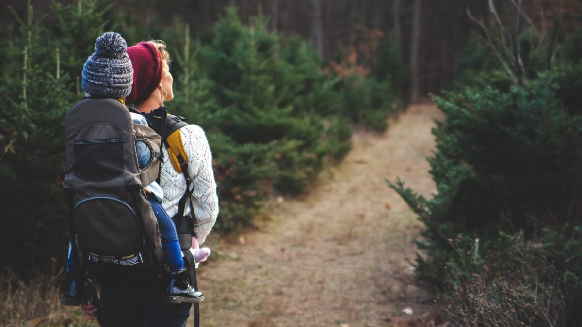 a person carrying a child on their back