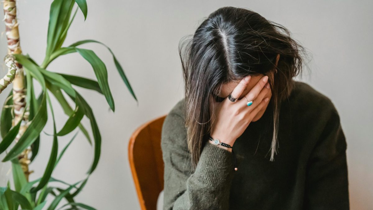 Woman holding her head