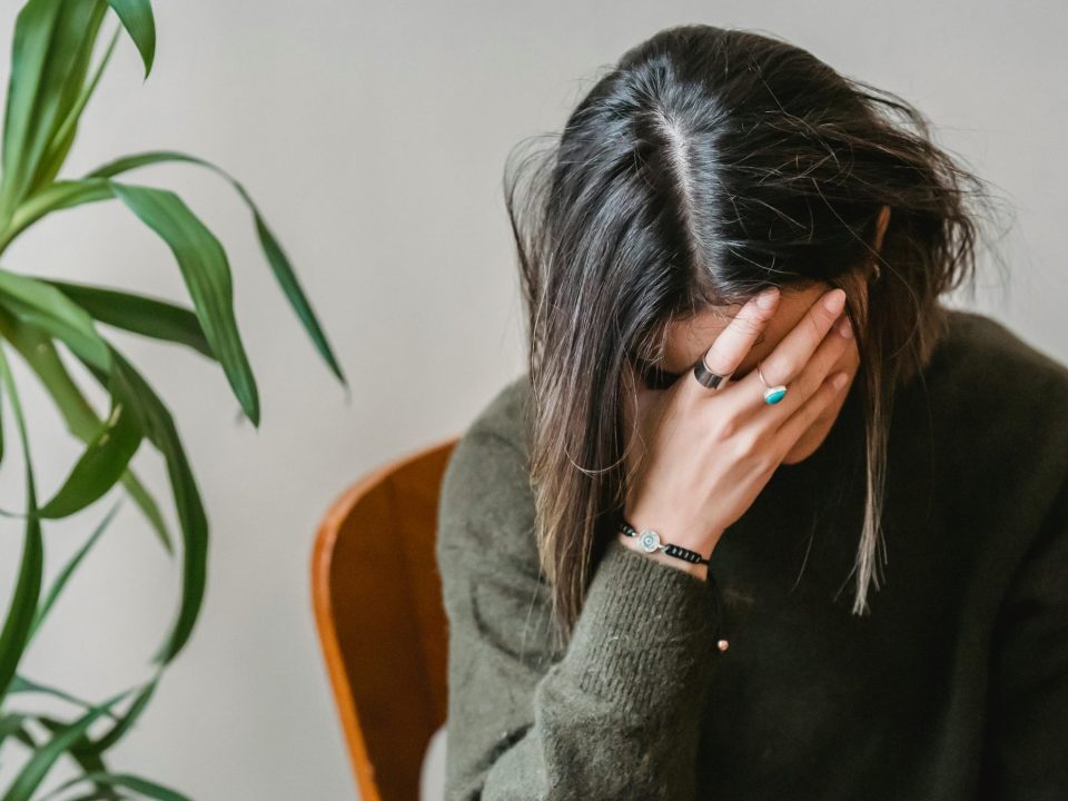 Woman holding her head